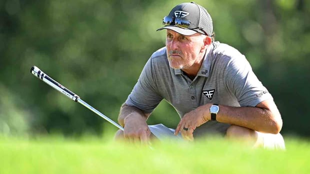Phil Mickelson looks over a putt on the 17th hole during the first round of the 2023 LIV Golf event at the Greenbrier.